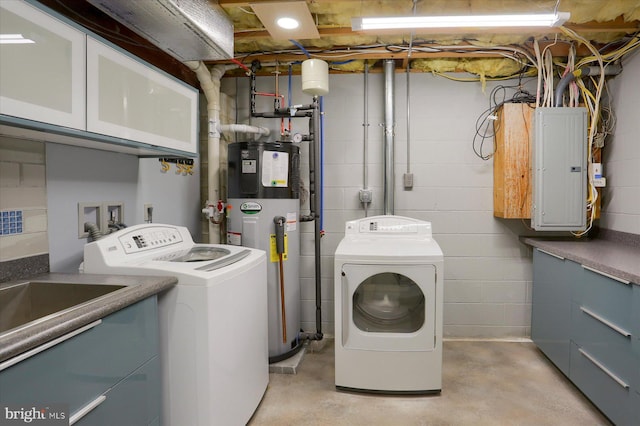 washroom with cabinet space, electric panel, hybrid water heater, and independent washer and dryer