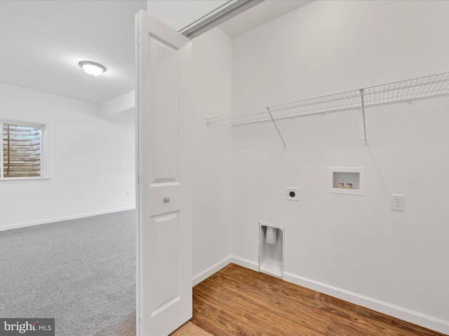 clothes washing area featuring laundry area, hookup for a washing machine, baseboards, and hookup for an electric dryer