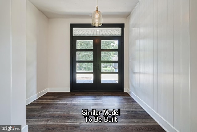 doorway to outside featuring french doors, dark wood finished floors, and baseboards