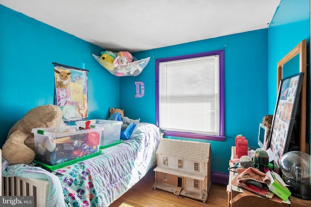 bedroom with wood finished floors