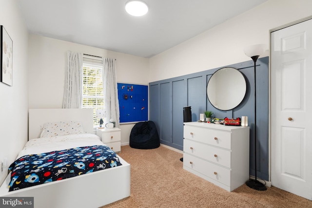 bedroom with light colored carpet