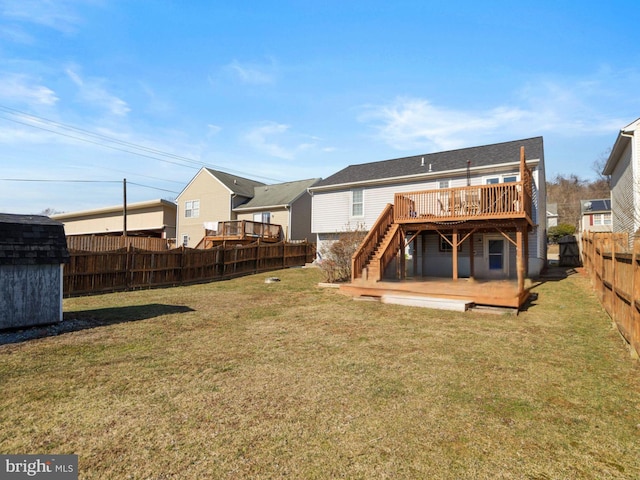 back of house featuring a fenced backyard, stairway, a deck, and a yard