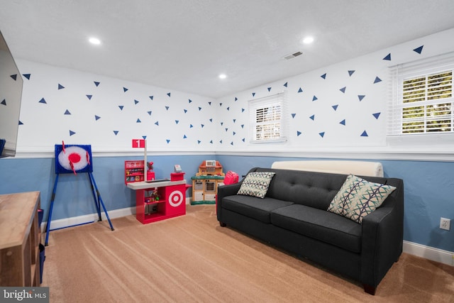 game room featuring carpet floors, visible vents, and baseboards