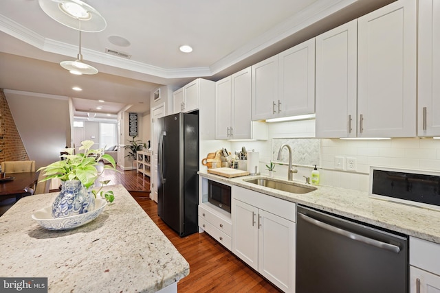 kitchen featuring dark wood-type flooring, a sink, white cabinets, appliances with stainless steel finishes, and light stone countertops