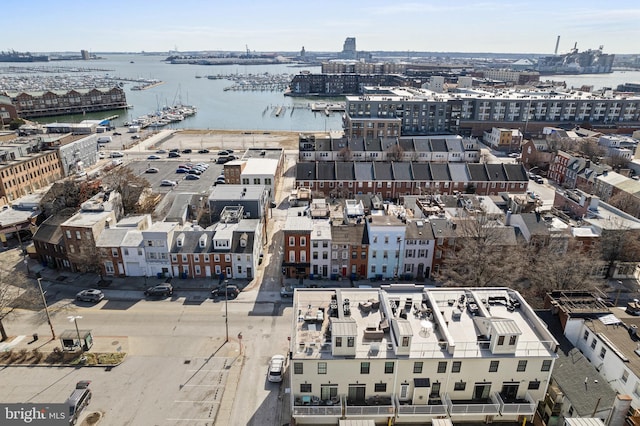 birds eye view of property with a view of city and a water view