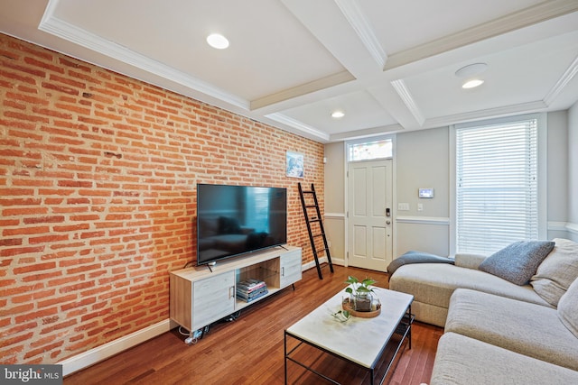 living room with brick wall, coffered ceiling, ornamental molding, beam ceiling, and dark wood-style floors