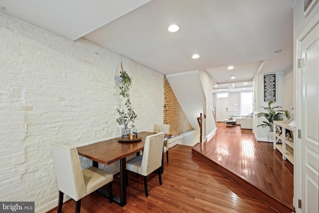 dining room with wood finished floors and recessed lighting