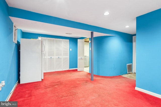 interior space featuring carpet, visible vents, baseboards, and recessed lighting