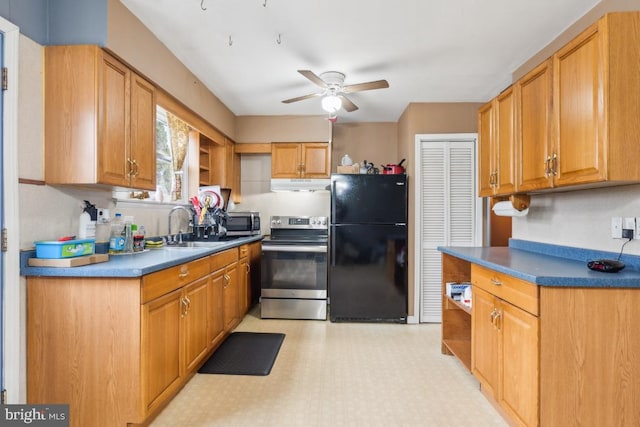 kitchen featuring light floors, stainless steel appliances, under cabinet range hood, open shelves, and a sink