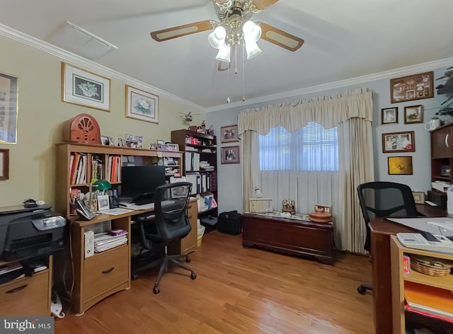 office area featuring ornamental molding, light wood-type flooring, and a ceiling fan