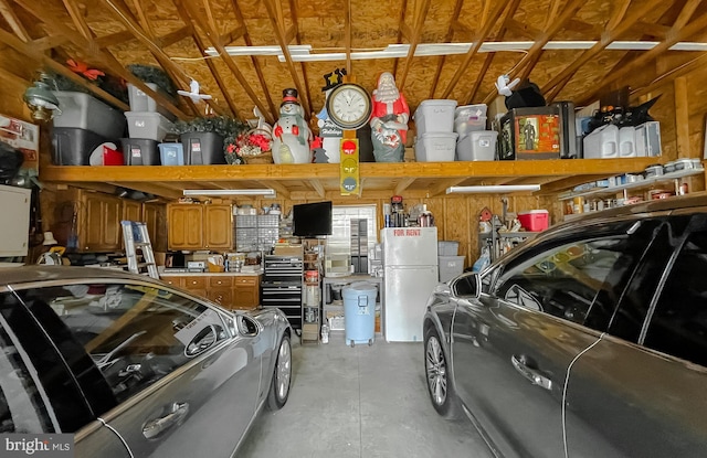 garage with freestanding refrigerator