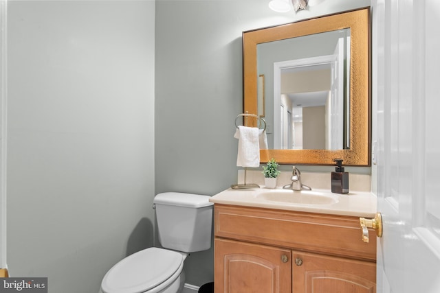 half bath with toilet and vanity