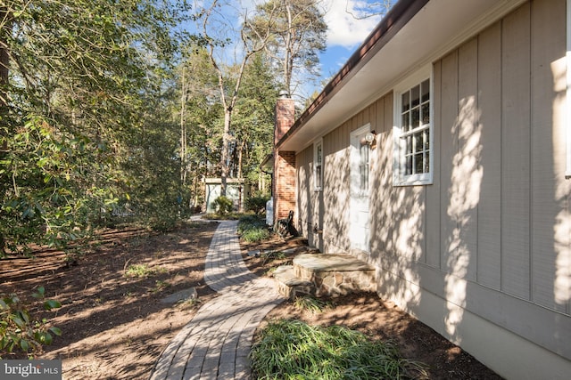 view of side of property with a chimney