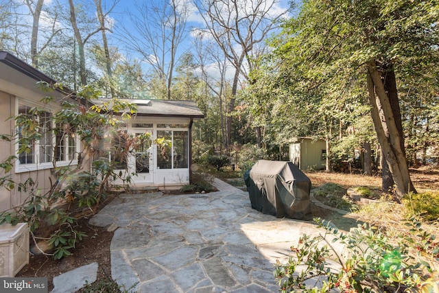 view of patio with a sunroom