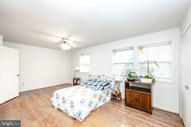 bedroom featuring a ceiling fan and light wood-type flooring