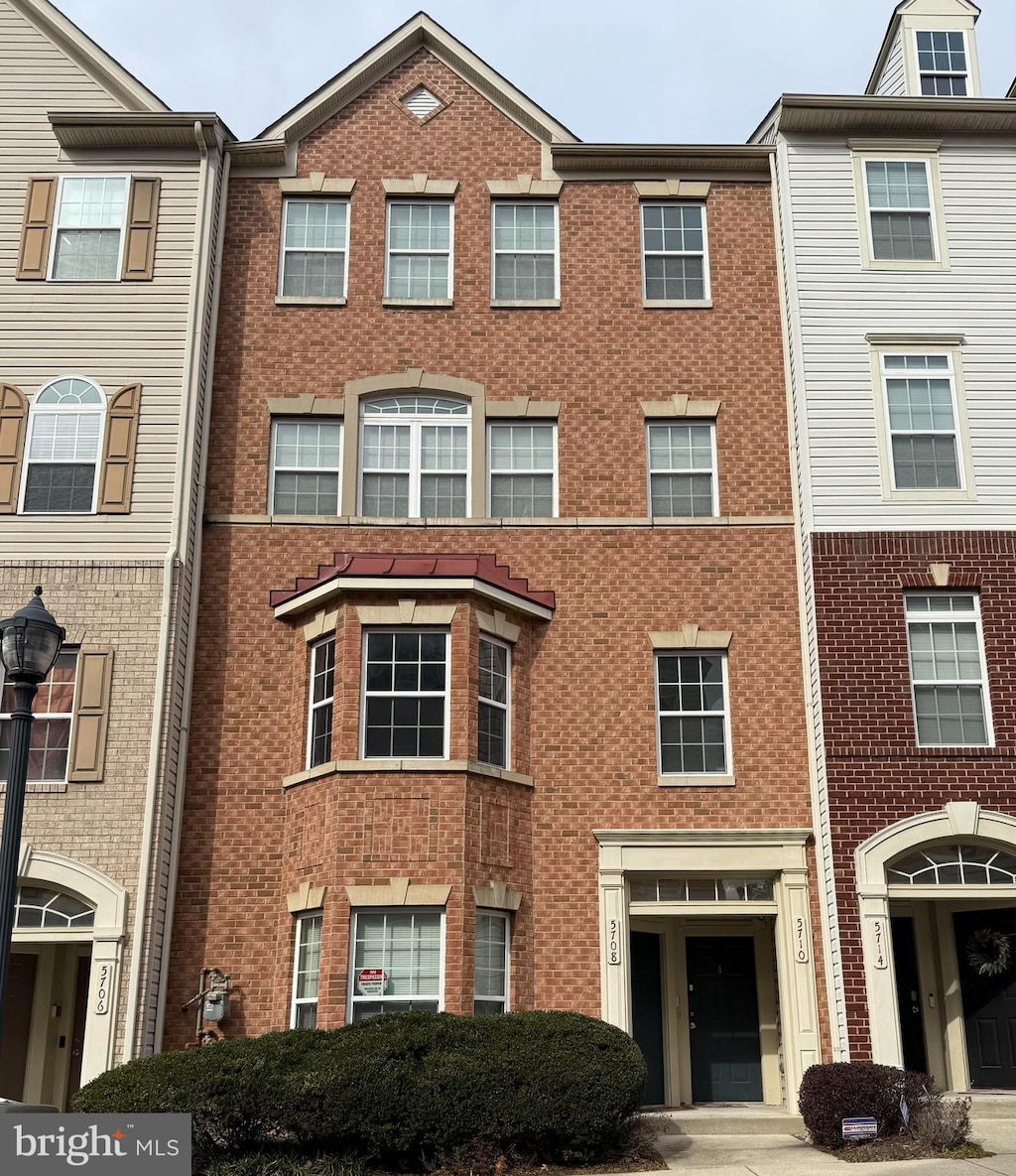 view of front of property with brick siding