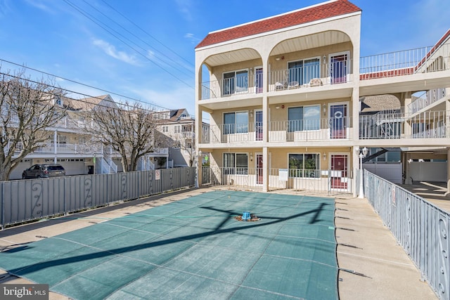 view of pool with fence