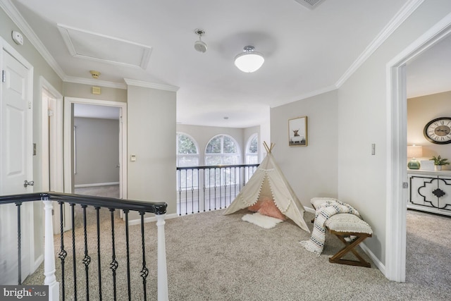 playroom with attic access, carpet, ornamental molding, and baseboards