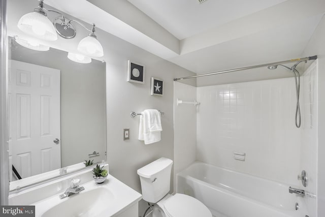 full bath featuring bathtub / shower combination, vanity, and toilet