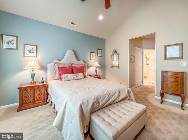 bedroom with light carpet, ensuite bath, baseboards, and visible vents