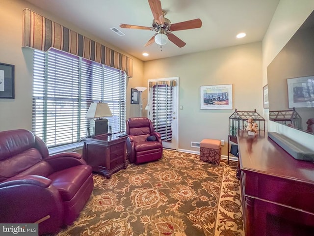 office space with recessed lighting, a ceiling fan, baseboards, visible vents, and carpet