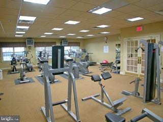 exercise room with a drop ceiling