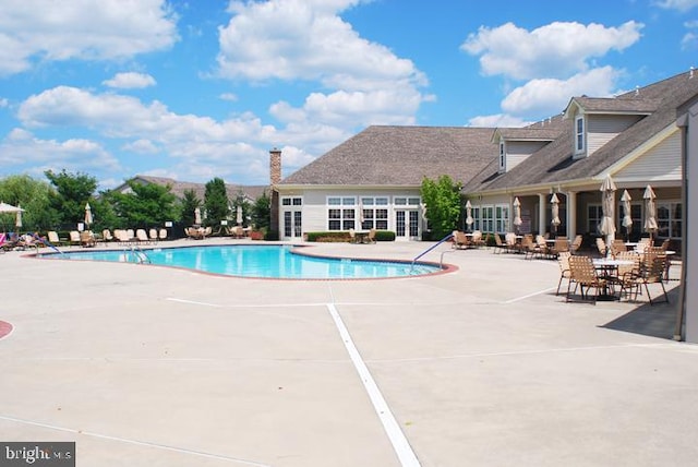 community pool with a patio