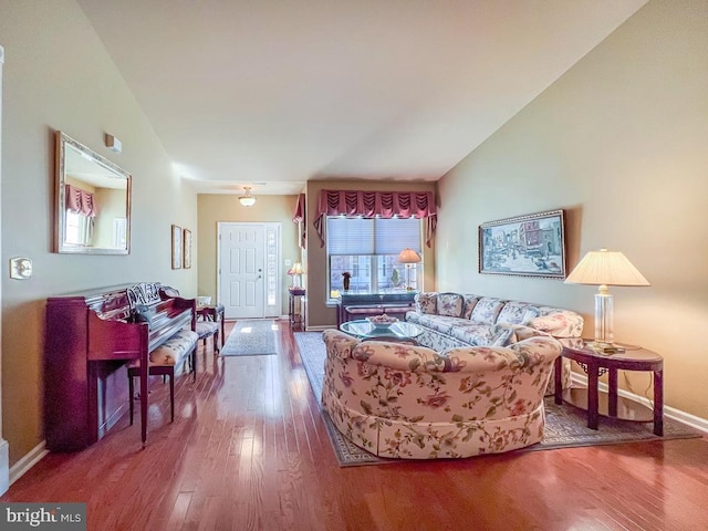 living area featuring wood finished floors and baseboards