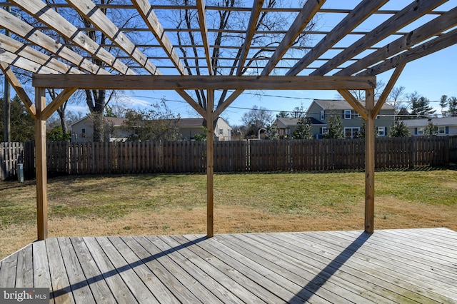 deck with a lawn, a fenced backyard, and a pergola