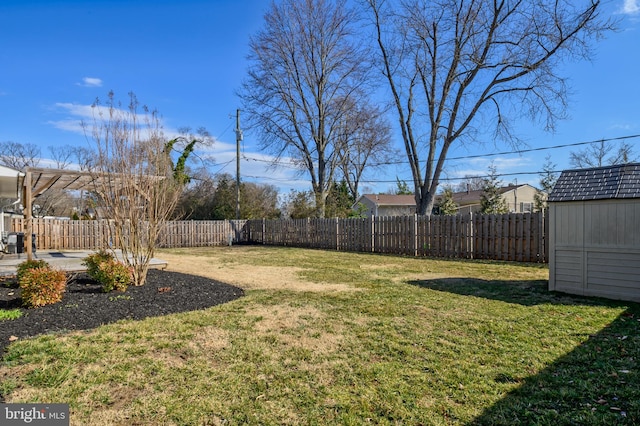 view of yard featuring a patio area, a shed, a fenced backyard, and an outdoor structure