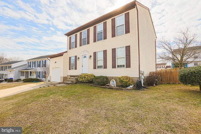 view of front of house featuring a garage, fence, concrete driveway, a residential view, and a front yard