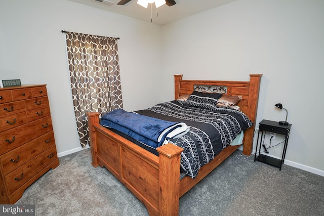 carpeted bedroom featuring a ceiling fan, visible vents, and baseboards