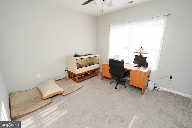 office with light carpet, ceiling fan, visible vents, and baseboards