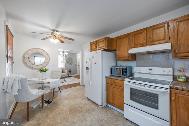 kitchen featuring brown cabinets, dark countertops, backsplash, white appliances, and under cabinet range hood