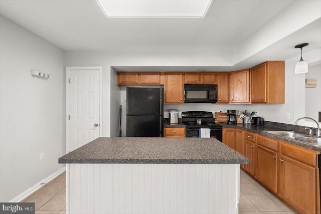 kitchen with light tile patterned floors, black appliances, dark countertops, and a sink