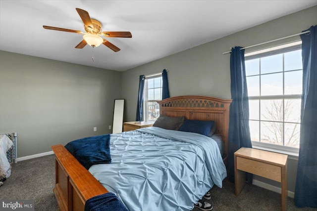 bedroom with carpet floors, a ceiling fan, and baseboards