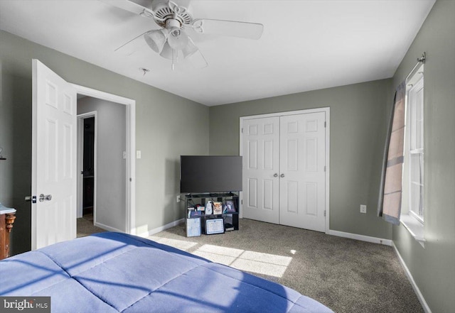 bedroom featuring ceiling fan, carpet floors, a closet, and baseboards