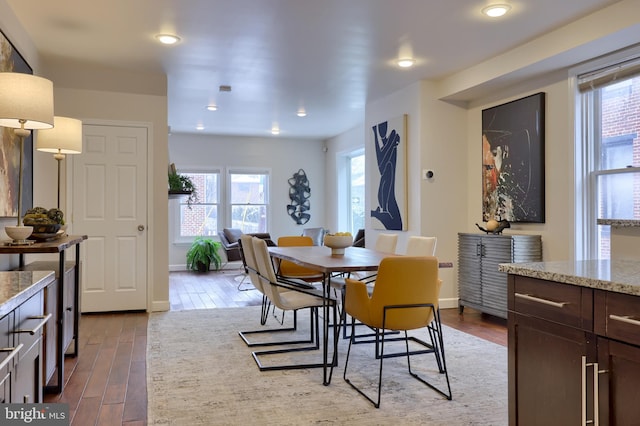 dining room with baseboards and dark wood finished floors