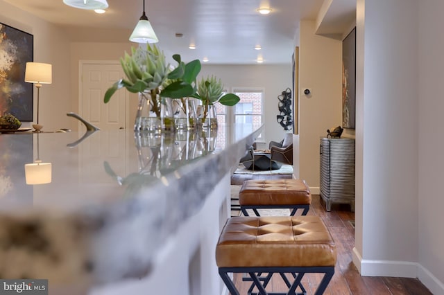 room details with baseboards and wood finished floors