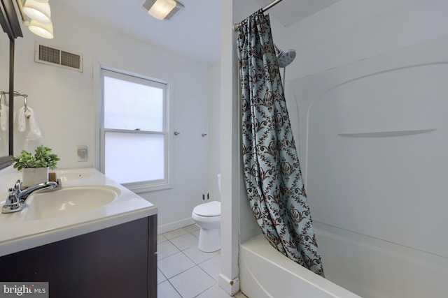 bathroom with visible vents, toilet, shower / tub combo, vanity, and tile patterned floors