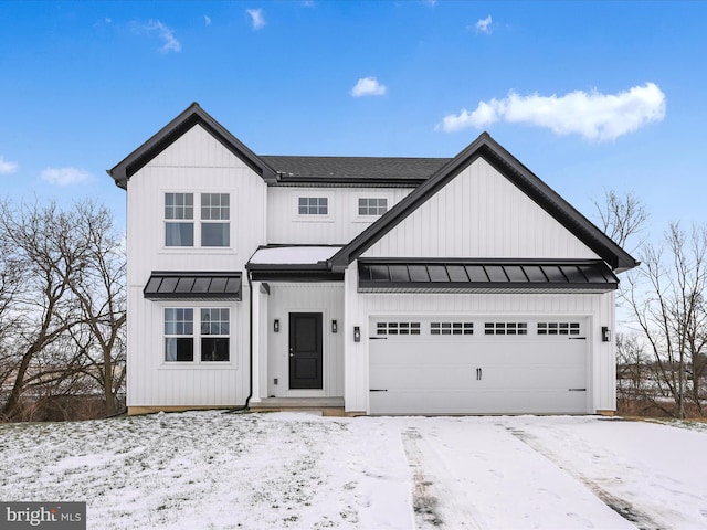 modern farmhouse style home featuring a garage, a standing seam roof, and board and batten siding