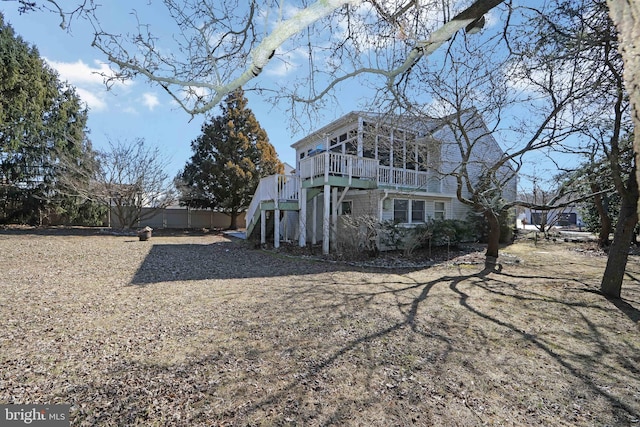 view of home's exterior featuring stairs