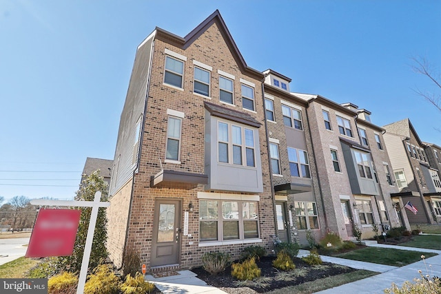 view of front facade featuring brick siding