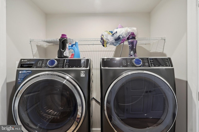 washroom with laundry area and washer and clothes dryer