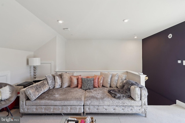 living room featuring lofted ceiling and recessed lighting