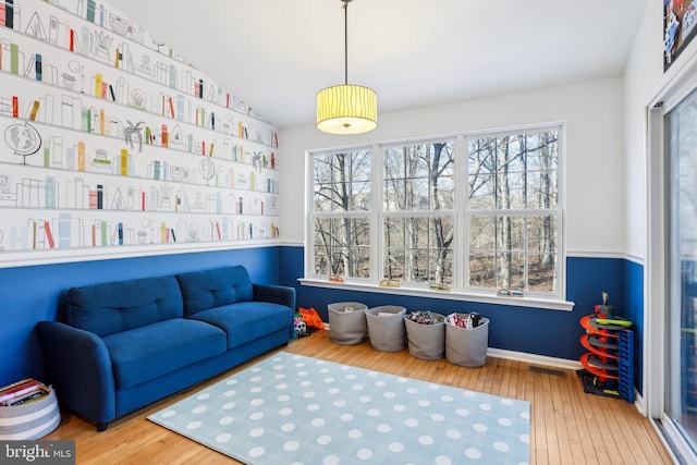 game room featuring visible vents and hardwood / wood-style floors