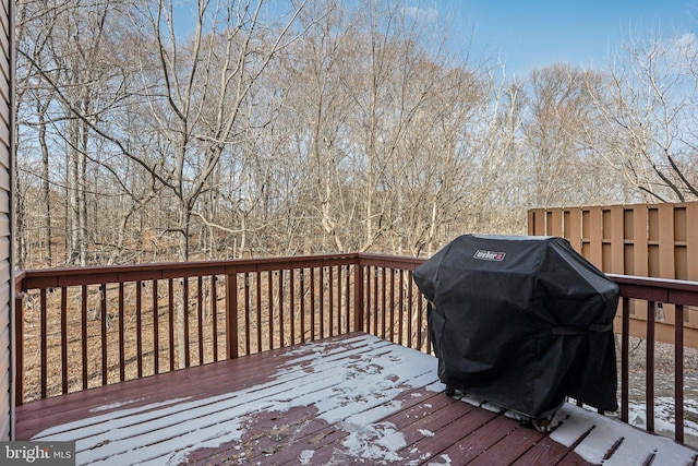 wooden deck with a grill