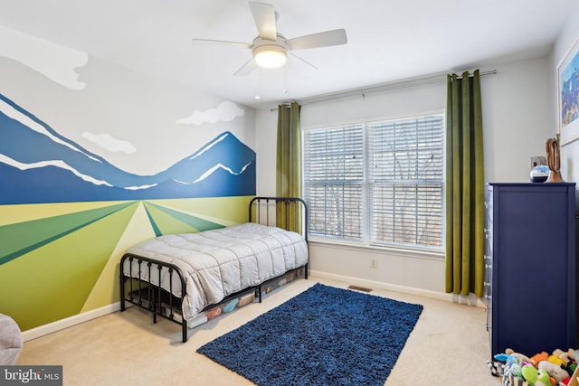 bedroom with carpet floors, baseboards, visible vents, and ceiling fan