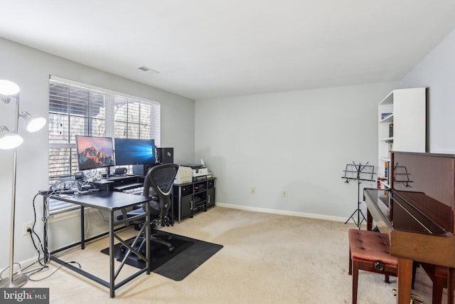 carpeted home office featuring visible vents and baseboards