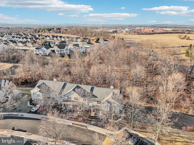 birds eye view of property with a residential view